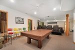 Open floor plan with air hockey, pool, and more